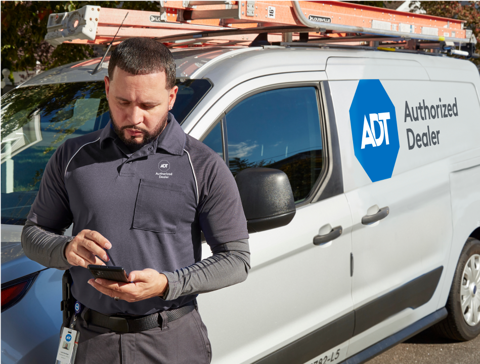 ADT installer next to van