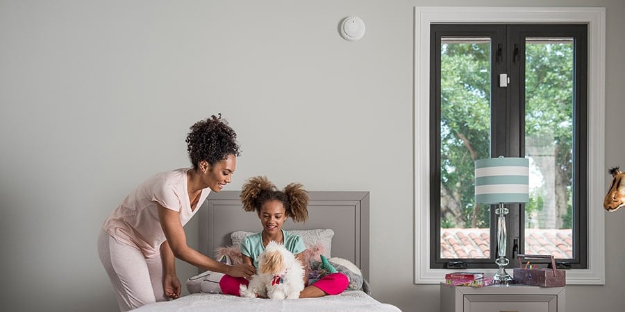 Family with Carbon Monoxide Detector in the Room