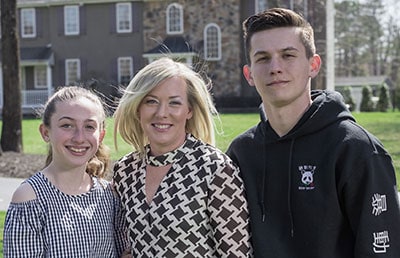 The McManus family in front of their New Jersey home.