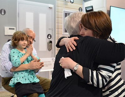 Amy Steffens and Sherry Broyles meet at an ADT-sponsored reunion in January, 2014