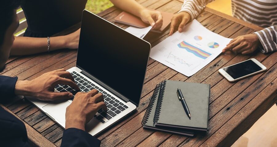 Businessman Using Laptop In Business Meeting